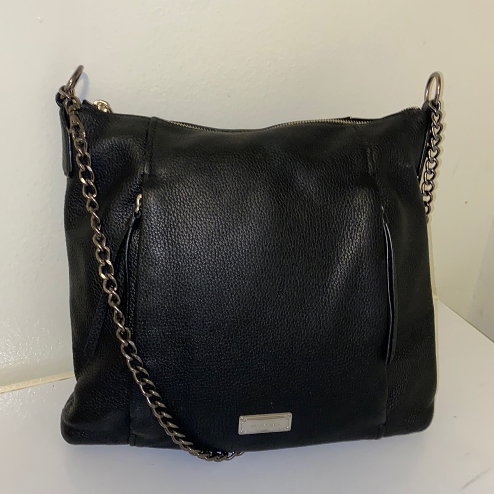 Michael Kors black bag with two front side zipper pockets